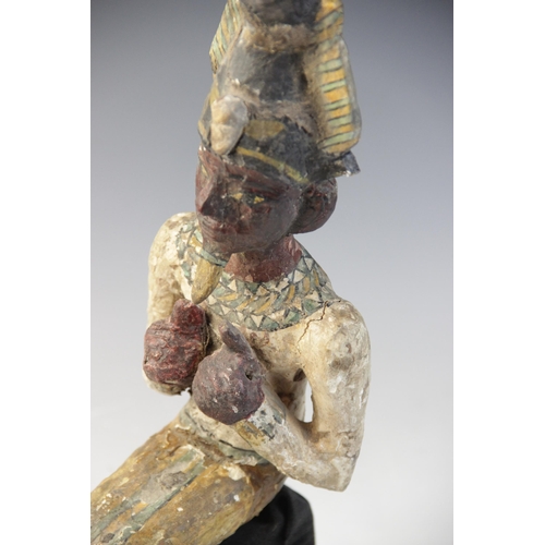 120 - An Egyptian style gesso painted seated wood figure of a pharaoh, wearing the atef crown, Not Ancient... 