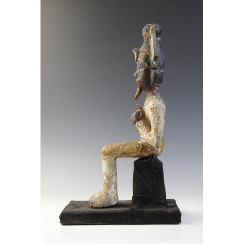 120 - An Egyptian style gesso painted seated wood figure of a pharaoh, wearing the atef crown, Not Ancient... 