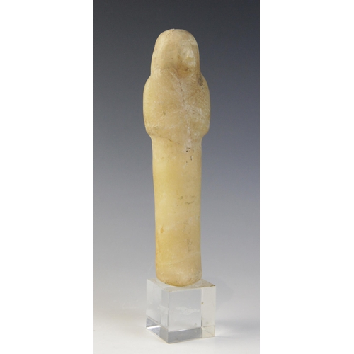 130 - An Egyptian alabaster shabti, some faint traces of the frontal column of hieroglyphic text remaining... 