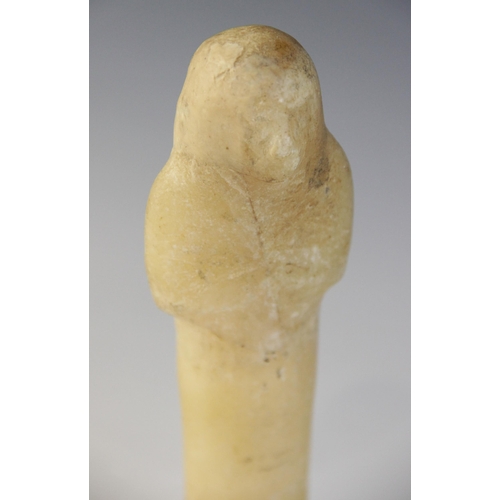 130 - An Egyptian alabaster shabti, some faint traces of the frontal column of hieroglyphic text remaining... 