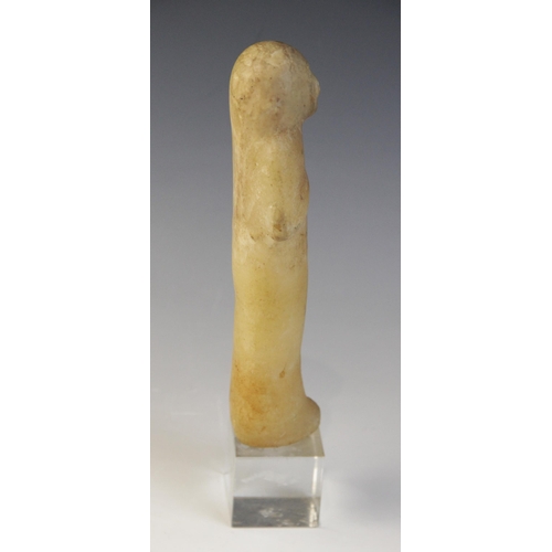 130 - An Egyptian alabaster shabti, some faint traces of the frontal column of hieroglyphic text remaining... 