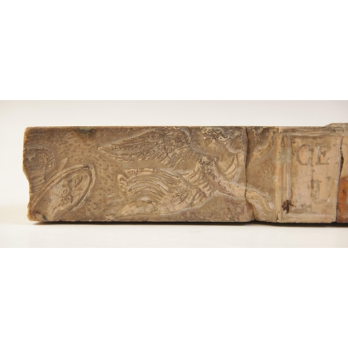 133 - A Giallo Antico square section rectangular relief with centrally engraved tabula supported by two wi... 