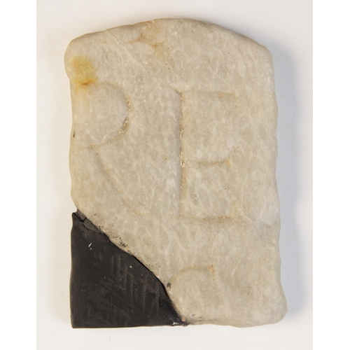 134 - A marble fragment, engraved with three letters, 12cm x 8cm (at fault) 

Provenance: Ex Alison Barker... 