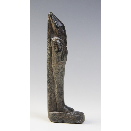 137 - An Egyptian basalt mummiform figure of Osiris, with carved details of the crook and flail, wearing t... 