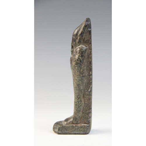 137 - An Egyptian basalt mummiform figure of Osiris, with carved details of the crook and flail, wearing t... 