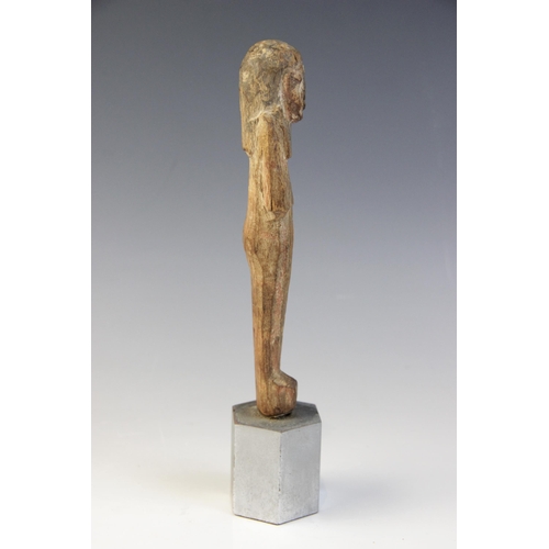 139 - An Egyptian wood shabti, schematically carved with traces of the original pigment remaining, New Kin... 