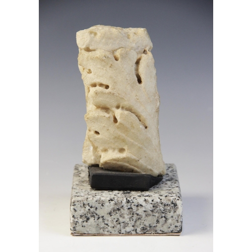 142 - A Roman marble fragment carved with an acanthus leaf, circa 2nd-3rd Century A.D., 14.5cm  x 7.5cm (a... 