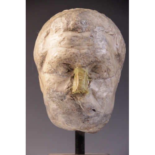 146 - A worn marble male head carved with furrowed brow, with restorations, height excluding base approxim... 