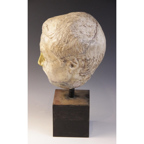 146 - A worn marble male head carved with furrowed brow, with restorations, height excluding base approxim... 