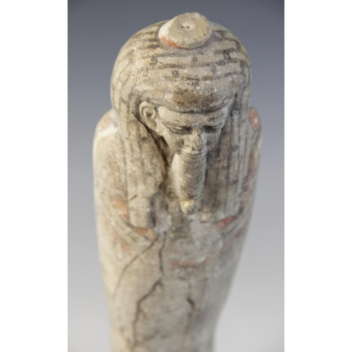 147 - An Egyptian style limestone mummiform figure with lappet wig and false beard, traces of polychrome p... 