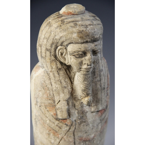 147 - An Egyptian style limestone mummiform figure with lappet wig and false beard, traces of polychrome p... 