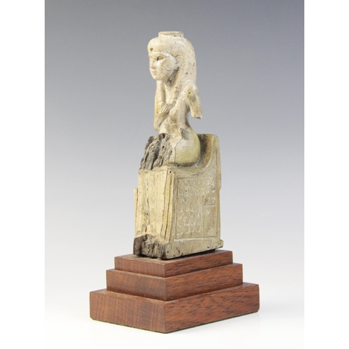 150 - An Egyptian style fragmentary steatite statue of Isis seated on her throne, the figure of the child ... 