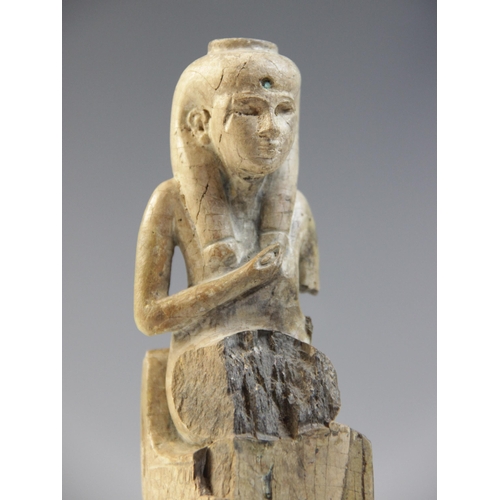 150 - An Egyptian style fragmentary steatite statue of Isis seated on her throne, the figure of the child ... 