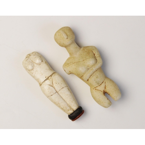 151 - Two Cycladic style figures,  Not Ancient, 8.5cm high and  10.5cm high (2) (at fault) 

Provenance: E... 