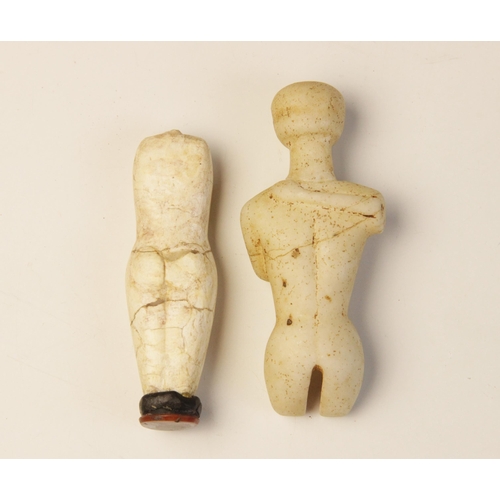 151 - Two Cycladic style figures,  Not Ancient, 8.5cm high and  10.5cm high (2) (at fault) 

Provenance: E... 