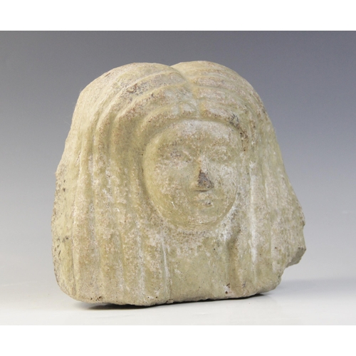 153 - An Egyptian style limestone bust of a woman, 16.5cm high and an Egyptian style stone head of a baboo... 