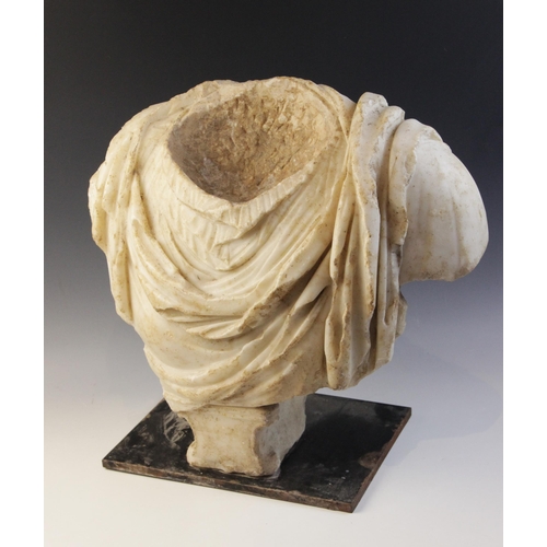 155 - A Roman marble bust with the folds of the tunic deeply carved, set on an integral  tapered socle, ci... 