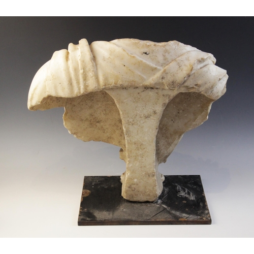 155 - A Roman marble bust with the folds of the tunic deeply carved, set on an integral  tapered socle, ci... 