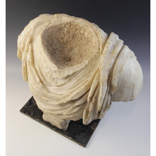 155 - A Roman marble bust with the folds of the tunic deeply carved, set on an integral  tapered socle, ci... 