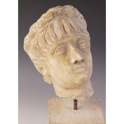 156 - A marble head of an emperor, probably Nero, wearing a wreath, After the Antique, 23.5cm high (at fau... 