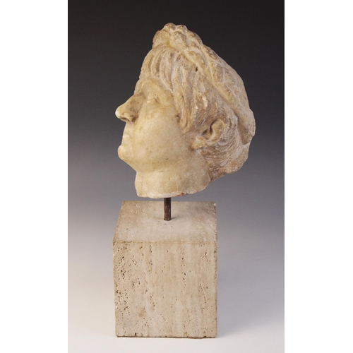 156 - A marble head of an emperor, probably Nero, wearing a wreath, After the Antique, 23.5cm high (at fau... 