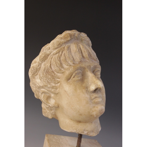 156 - A marble head of an emperor, probably Nero, wearing a wreath, After the Antique, 23.5cm high (at fau... 