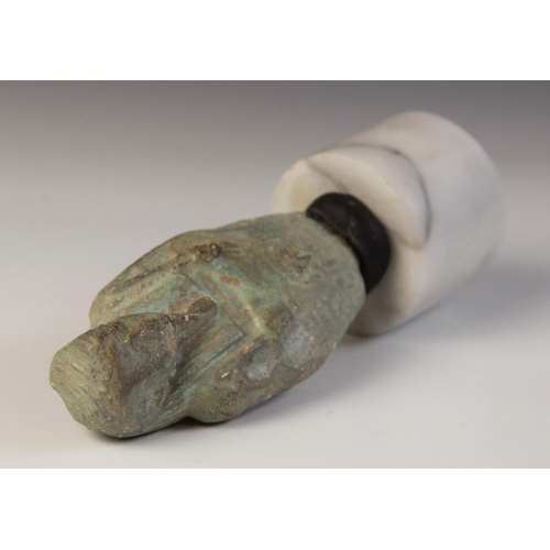 159 - A fragmentary Egyptian blue glazed faience shabti, holding a pick and a hoe, worn bands of horizonta... 