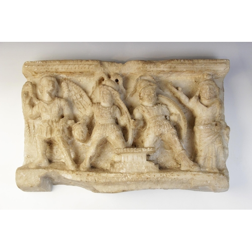 161 - A marble rectangular relief deeply carved with four figures, two shield-bearing soldiers, one carryi... 