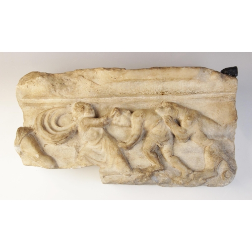 162 - A marble fragmentary relief depicting a spotted hound or panther attacking  the back of a man, bendi... 