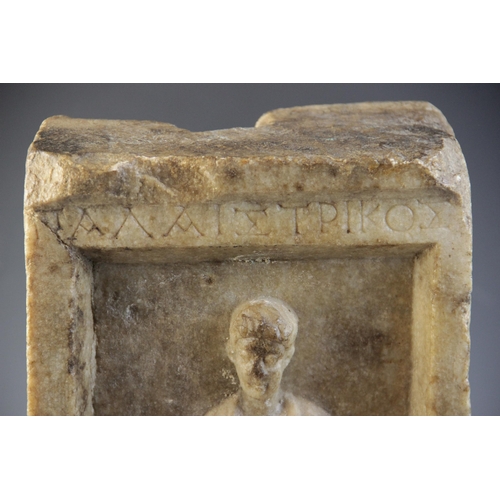 163 - A marble grave stele of rectangular form, the recessed area carved in relief with a standing male fi... 