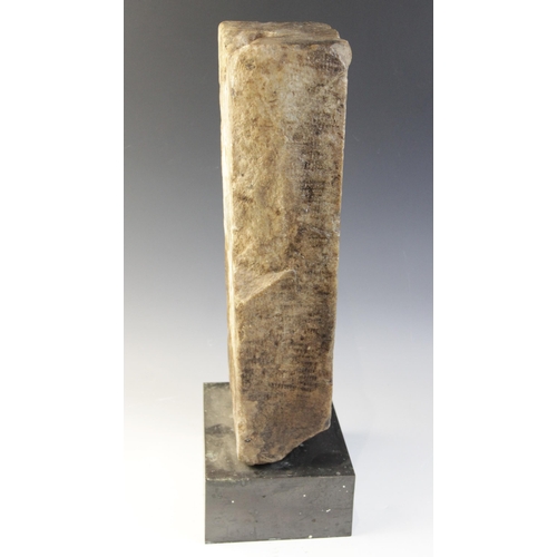 163 - A marble grave stele of rectangular form, the recessed area carved in relief with a standing male fi... 