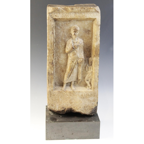 163 - A marble grave stele of rectangular form, the recessed area carved in relief with a standing male fi... 