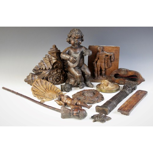 483 - A selection of carved wood items, to include a carved oak panel, carved with a figure, 21cm high, a ... 