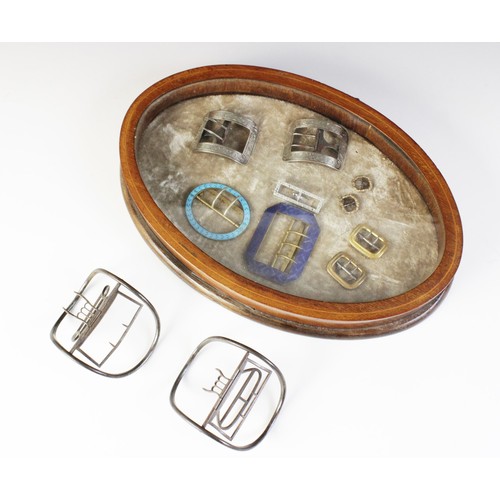 12A - A selection of 19th century and later buckles, to include a silver coloured pair, of curved rectangu... 