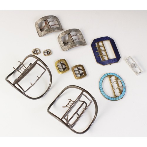 12A - A selection of 19th century and later buckles, to include a silver coloured pair, of curved rectangu... 