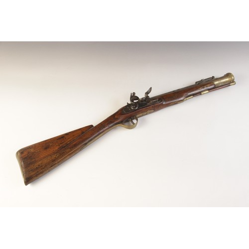 66 - A replica Flintlock Blunderbuss, the round bronze barrel stamped ‘A093’, half-stocked in walnut and ... 