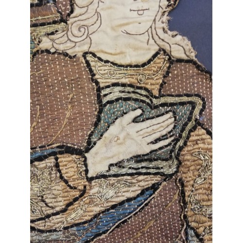 262 - An embroidery of a religious figure, possibly Saint Catherine, possibly 17th Century, comprised of c... 