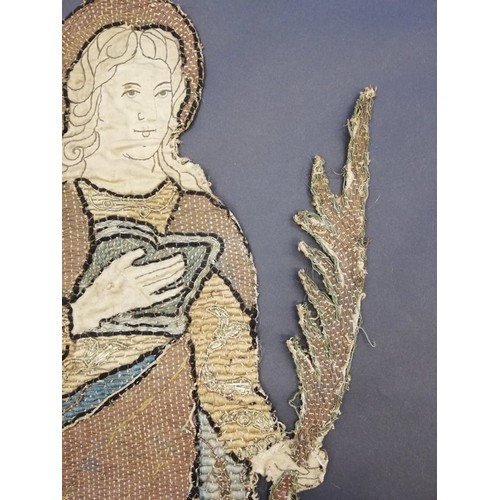 262 - An embroidery of a religious figure, possibly Saint Catherine, possibly 17th Century, comprised of c... 