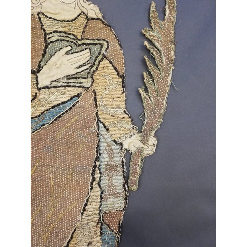 262 - An embroidery of a religious figure, possibly Saint Catherine, possibly 17th Century, comprised of c... 