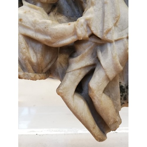 89 - A carved alabaster panel fragment, modelled in the 15th century Nottingham manner with a high relief... 