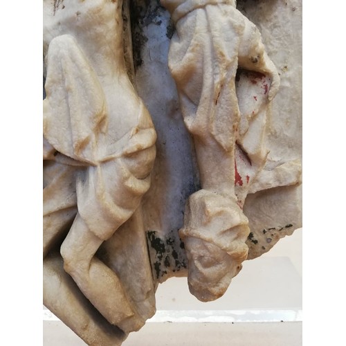 89 - A carved alabaster panel fragment, modelled in the 15th century Nottingham manner with a high relief... 