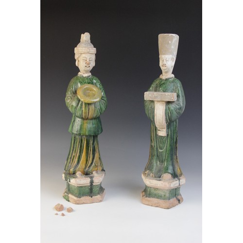 344 - A pair of large Chinese Sancai glazed attendants, possibly Ming dynasty, male and female, one modell... 