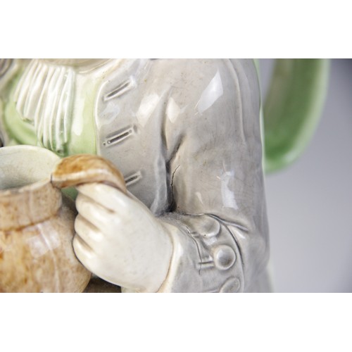 360 - A Staffordshire pearlware Toby Jug, circa 1790, of traditional form modelled holding a jug in both h... 