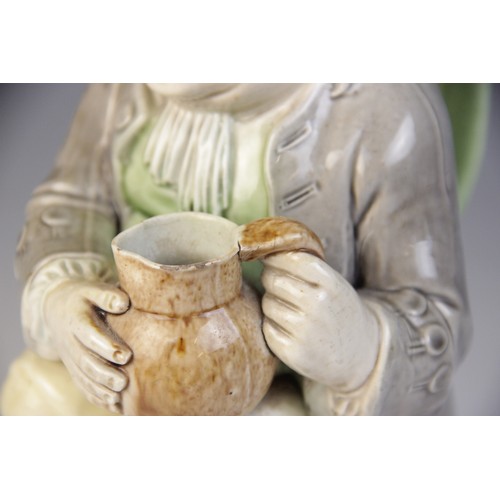 360 - A Staffordshire pearlware Toby Jug, circa 1790, of traditional form modelled holding a jug in both h... 