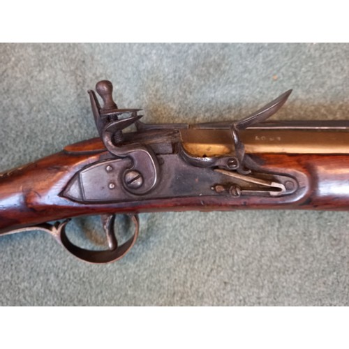 66 - A replica Flintlock Blunderbuss, the round bronze barrel stamped ‘A093’, half-stocked in walnut and ... 