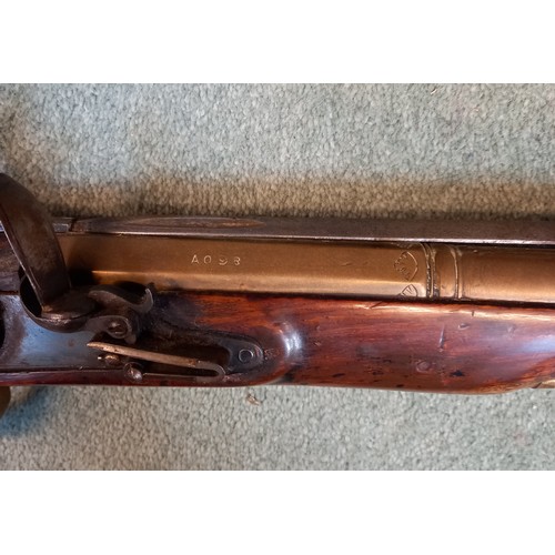 66 - A replica Flintlock Blunderbuss, the round bronze barrel stamped ‘A093’, half-stocked in walnut and ... 