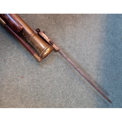 66 - A replica Flintlock Blunderbuss, the round bronze barrel stamped ‘A093’, half-stocked in walnut and ... 