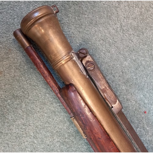 66 - A replica Flintlock Blunderbuss, the round bronze barrel stamped ‘A093’, half-stocked in walnut and ... 