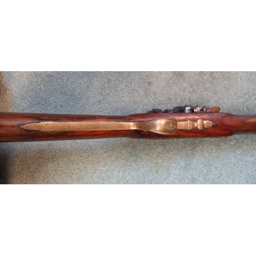 66 - A replica Flintlock Blunderbuss, the round bronze barrel stamped ‘A093’, half-stocked in walnut and ... 