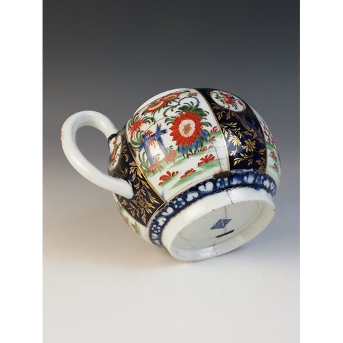 363 - A Worcester porcelain teapot circa 1780, decorated in a kakiemon design with alternating panels, the... 